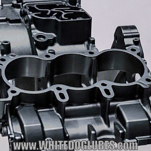 Close up of a black crankcase that has been painted showing the rough edges
