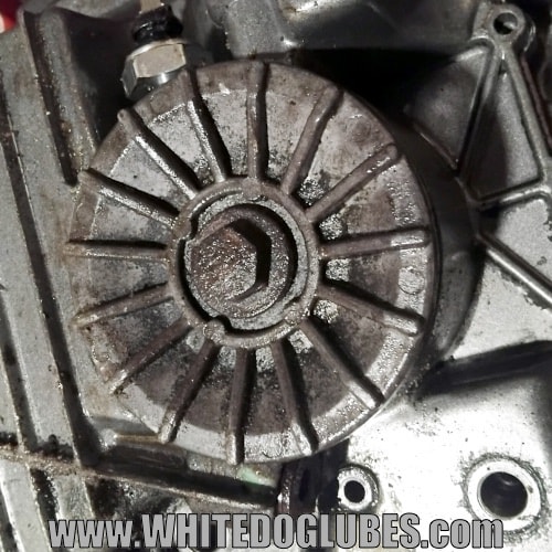 The oil filter casing with the cover in place shown from the bottom of the engine